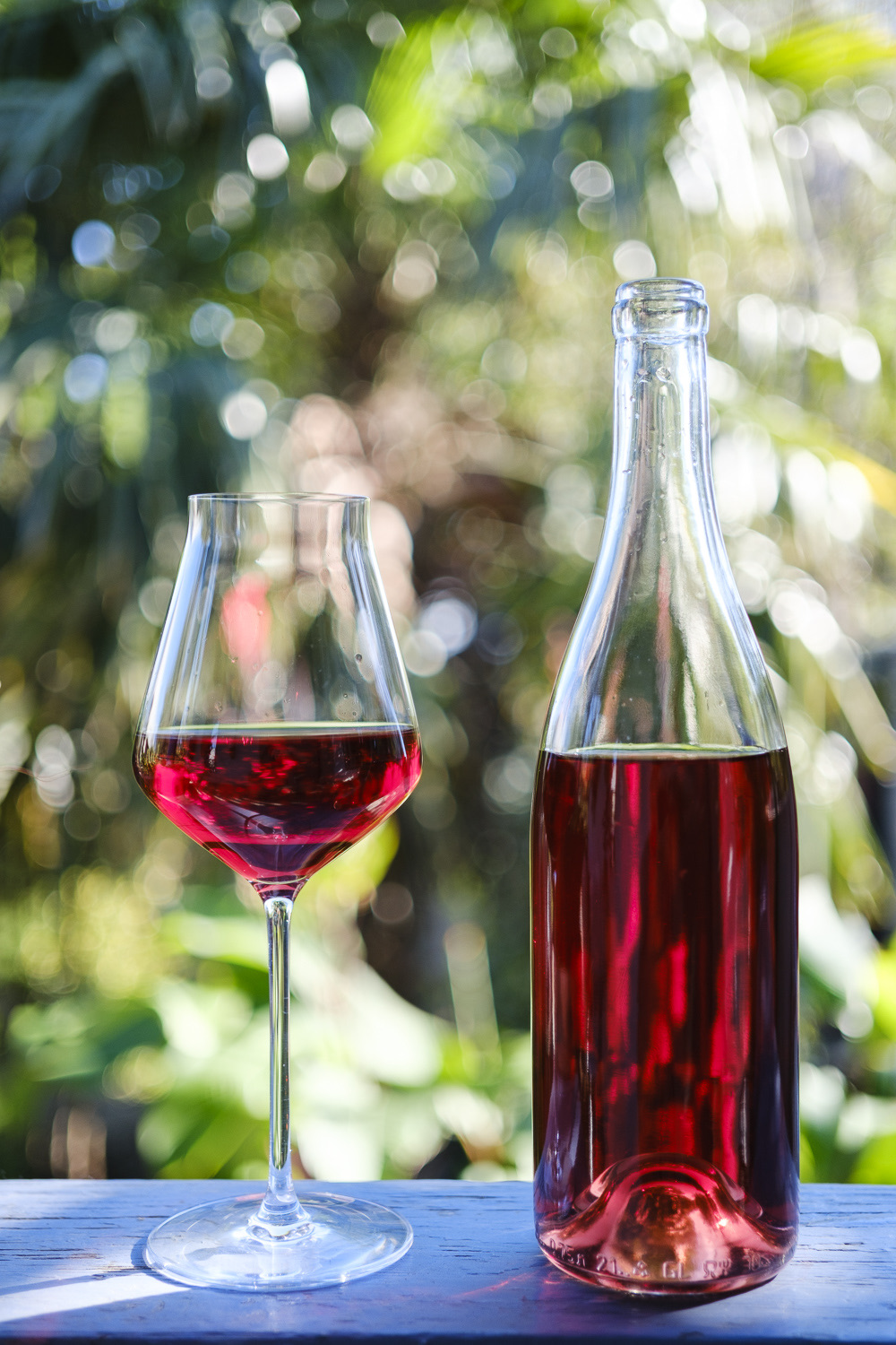 Tavkveri 2024 — clear unlabelled bottle, deep red wine